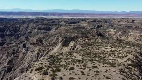 Dramatic-badlands-canyon,-flat-mesas-on-eroded-dry-mountain-plateau