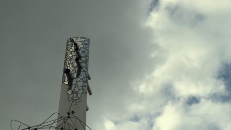 Artistic-adornment-along-the-Spanish-coastline,-highlighting-creativity,-and-promoting-tourism,-set-against-a-backdrop-of-cloudy-skies