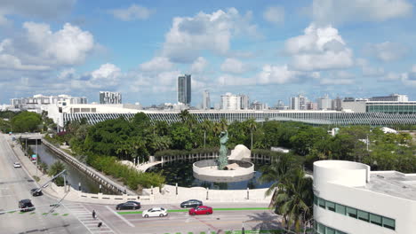 Aerial-View-of-Holocaust-Memorial-and-Traffic-in-Bayshore-Neighborhood-of-Miami-Beach,-Florida-USA,-Dolly-Drone-Shot