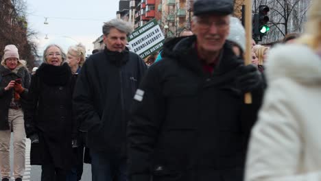 Covid-regulation-protest-march-in-Stockholm,-Sweden,-close-view