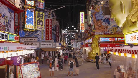 High-moving-slow-motion-shot-of-Ebisu-Higashi-District's-Bustling-Streets,-Crowded-with-Vibrant-City-Lights-and-Energetic-Nightlife-Osaka,-Japan-2