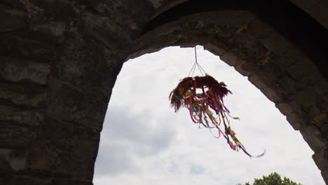 Dream-Catcher-Artcraft-Hanging-In-Historic-Architecture-During-Cloudy-Sky