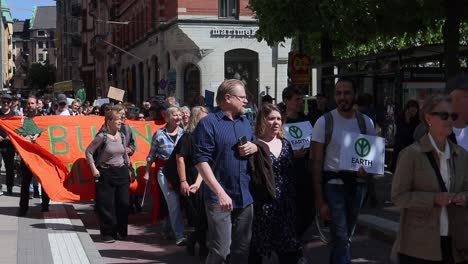 Protesters-march-at-environmental-demonstration-in-Sweden,-slomo