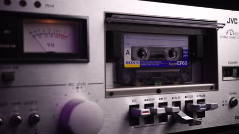 Sony-Audio-Cassette-Tape-Playing-in-Vintage-JVC-Deck-Player-With-VU-Meters