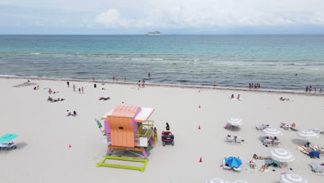 Miami,-Florida-USA,-Aerial-View-of-South-Beach,-People-on-Sand-and-Ocean-Horizon---Drone-Shot