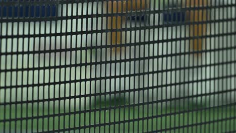 Close-up-of-a-professional-tennis-net-designed-for-ATP-tournaments,-made-with-durable-rubber-material