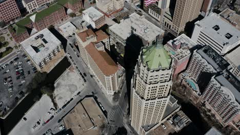 Overhead-drone-shot-of-an-American-flag-on-top-of-the-Tower-Life-Building-in-Texas