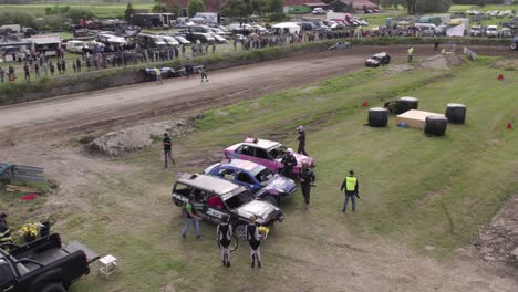 Aerial-view-of-old-cars-racing-on-dirt-track,-Friesland,-Netherlands