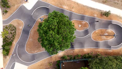 Grammont-Pumptrack-skatepark-with-Central-Greenery,-aerial-top-view