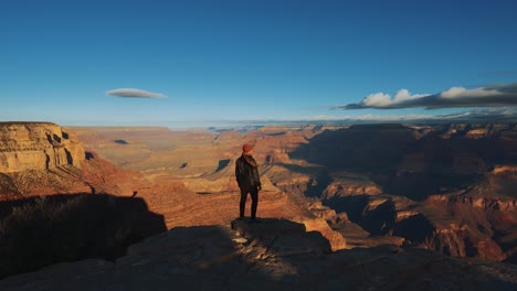 One-young-man-standing-at-Grand-Canyon,-Arizona