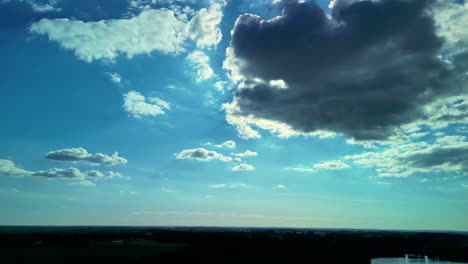 the-beautiful-sight-of-the-sun-shining-from-behind-the-clouds,-aerial-view