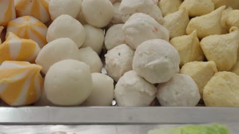 Fish-Balls-and-Various-Ingredients-Trays-For-Shabu-Shabu-Asian-Food,-Close-Up