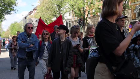 Journalist-interviews-protester-at-climate-march-in-Stockholm,-slomo
