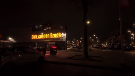 Exterior-of-Amsterdam-Noord-Vogelbuurt-parking-lot-in-front-of-Dirk-van-den-Broek-at-night