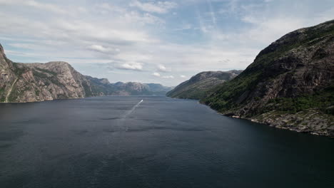 Aerial-shot,-panning-over-the-water-of-Lysefjord,-Norway
