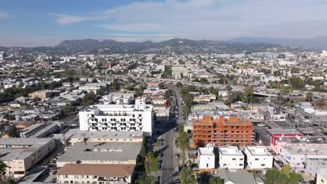 Aerial-View-of-East-Hollywood-Neighborhood-of-Los-Angeles-CA-USA,-Buildings,-Streets-and-Highway-Traffic,-Drone-Shot