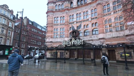 The-Palace-Theatre-on-Shaftesbury-Avenue-in-London's-West-End-on-rainy-morning,-currently-showing-performances-of-the-popular-Harry-Potter-and-the-Cursed-Child