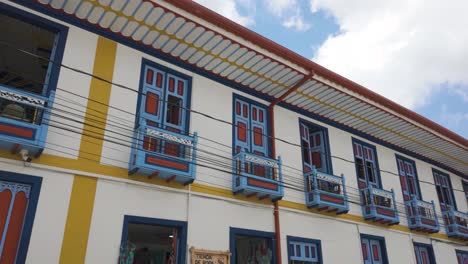 Looking-Up-At-Colourful-Colonial-Style-Wooden-Balconies-in-Filandia-Colombia