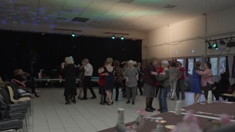 Wide-angle-shot-of-a-senior-only-social-dance-class-in-a-dance-hall