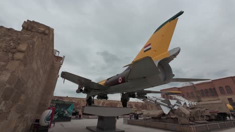 Old-war-plane-exhibited-outdoor-at-National-Military-Museum-of-Cairo-on-a-cloudy-day