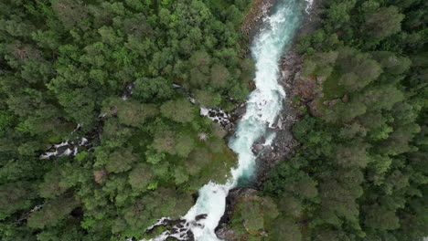 Top-down-aerial-view,-tracking-over-a-fast-flowing-river-in-Norway