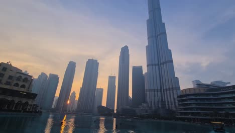 Downtown-Dubai-at-Sunset,-Burj-Khalifa-Skyscraper-and-Fountain-Lake-Panorama