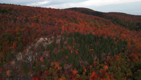 aerial-view-over-a-colorful-canadian-forest-at-autum-in-quebec-province,-Mont-Sourire,-Saint-Donat,-Quebec-province,-Canada