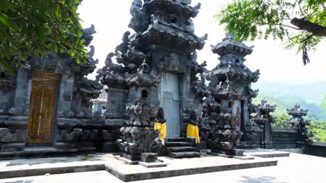 A-place-of-worship,-Pura-Girinatha-Balinese-Hindu-temple,-with-decorated-Indonesian-statues-in-the-capital-city-of-East-Timor,-Southeast-Asia