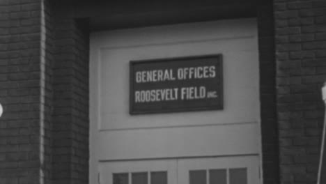 Metal-Plaque-Above-Entrance-Gate-of-Roosevelt-Field-Airport-in-New-York-1930s