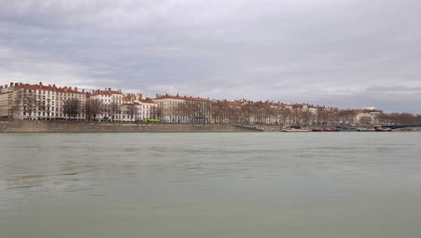 Rhone-River-Gliding-Through-a-Wintery-Day-in-Lyon,-Painting-a-Serene-Picture-of-Urban-Beauty