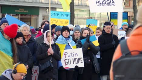 Slomo-of-female-protesters-applauding-at-rally-against-war-in-Ukraine
