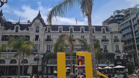 Place-du-Casino,-Famous-Plaza-in-Monte-Carlo,-Monaco-on-Sunny-Summer-Day,-Buildings-and-People,-Panorama