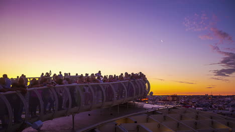 Tourists-sightseeing-sunset-in-Spain,-mediterranean-gradient-skyline-at-cerro-de-la-encina,-Almayate-alto-Malaga,-Spanish-landscape,-golden-violet-sky-with-first-stars