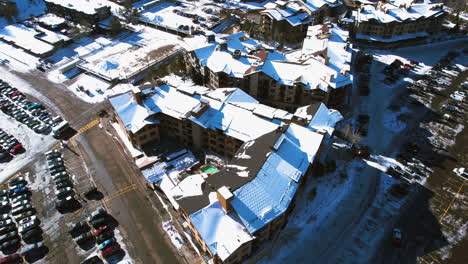 Aerial-View-of-Olympic-Valley-and-Village,-Lake-Tahoe-CA-USA,-Palisades-Ski-Resort-on-Sunny-WInter-Day,-Revealing-Drone-Shot