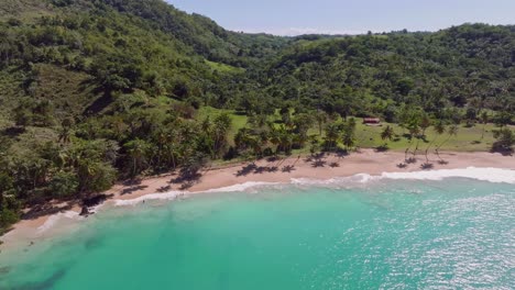 Drone-flying-toward-Playa-Colorada,-Las-Galeras-in-Dominican-Republic