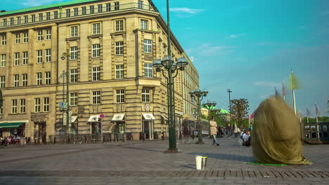 Reverse-time-lapse-shot-of-two-performers-building-their-act-in-a-square-in-Prague