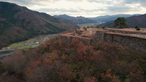 Takeda-Castle-Ruins,-Aerial-Panoramic-Landscape-of-Japanese-Ruins,-Fortress-of-Old-Civilization-Protection-Against-Attacks,-Japan-Travel-Aerial-Drone