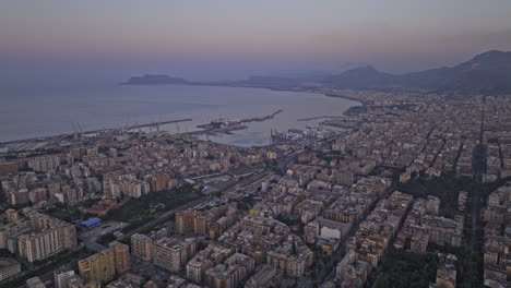 Palermo-Italy-Aerial-v6-cinematic-drone-fly-towards-Marina-Villa-Igiea-and-Fincantieri-shipyard-capturing-urban-cityscape-and-Tyrrhenian-sea-views-at-dusk---Shot-with-Mavic-3-Cine---May-2023