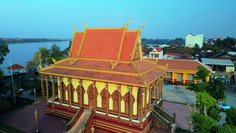 Typical-Khmer-pagoda-during-late-afternoon-sun-on-the-banks-of-the-river-Mekong,-Stung-Treng,-Cambodia