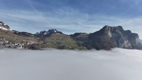 Idyllic-Amden-above-Walensee's-Winter-Mist,-Switzerland