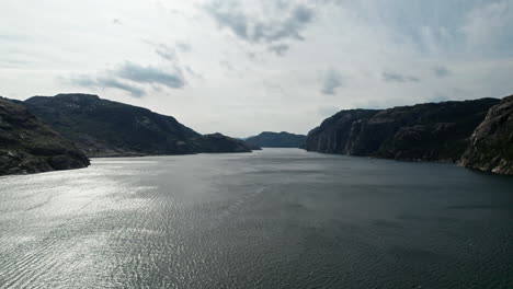 Aerial-shot,-descending-onto-the-water-of-Lysefjord,-Norway