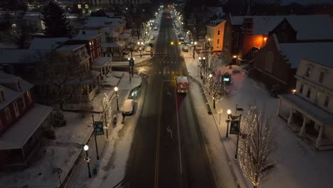 Snow-covered-small-town-America-at-night