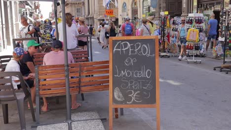 Tourist-outside-the-hotel-in-Palermo-Italy-Via-Vittorio-Emanuele-Street