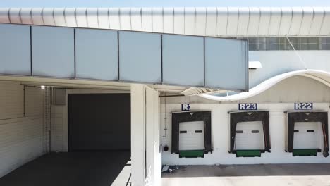 Zooming-out-drone-shot-of-facade-and-roof-of-medicinal-distribution-center-near-Mexico-City