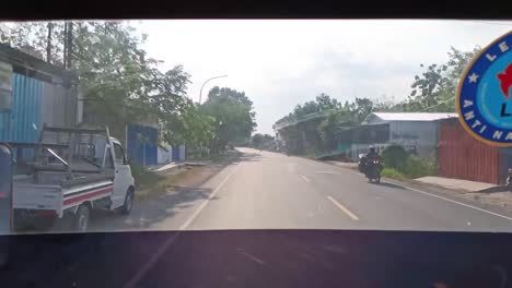 Pov-from-inside-a-bus-driving-in-Central-Java,-Indonesia