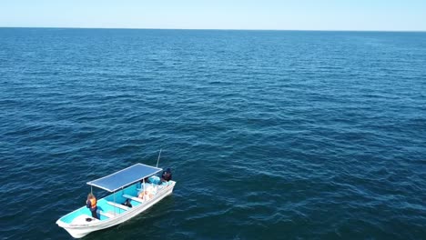 Tourists-on-touristic-boat-navigating-in-open-sea-for-tourboat