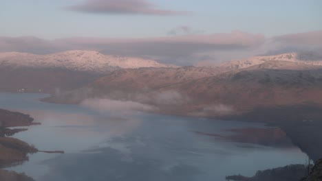 Static-shot-of-snow-capped-mountains-surrounding-Loch-Katrine-from-Ben-A'an