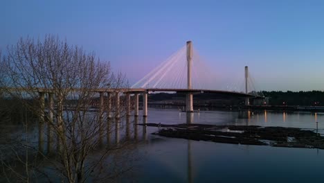 Port-Mann-Bridge-over-the-Fraser-River,-Colorful-Sunset-Sky