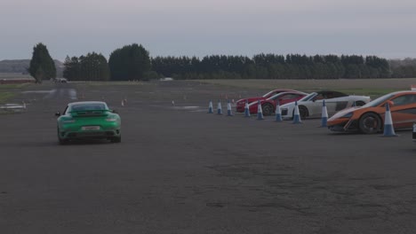 Close-up-shot-of-a-Porsche-911-heading-out-onto-a-racetrack-with-no-one-else