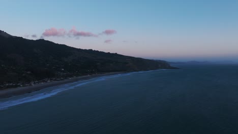 Hazy-dusk-drone-aerial-shot-of-Stinson-beach-in-California